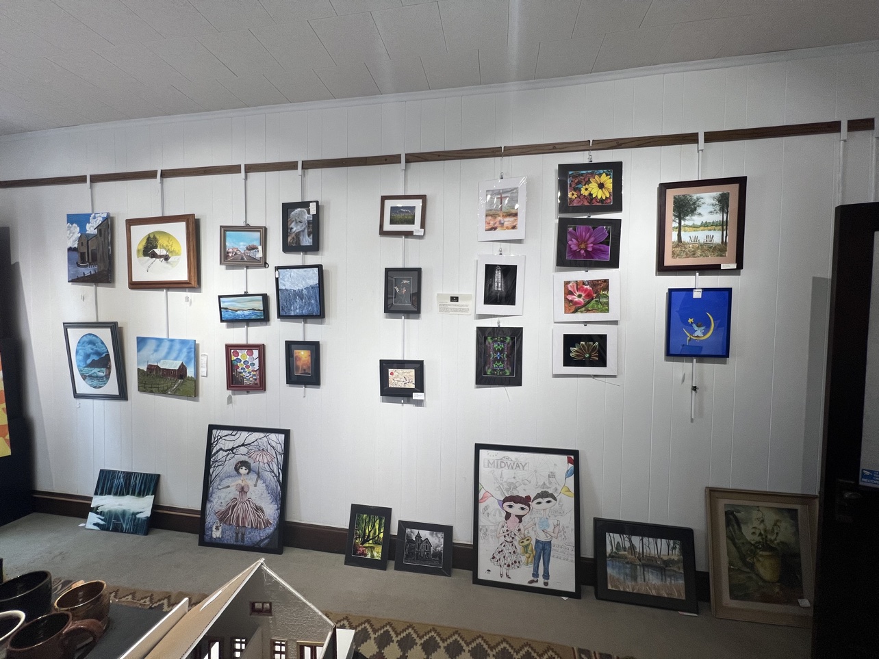 One wall of the gallery, hung with work from Pickaway County painters and photographers.