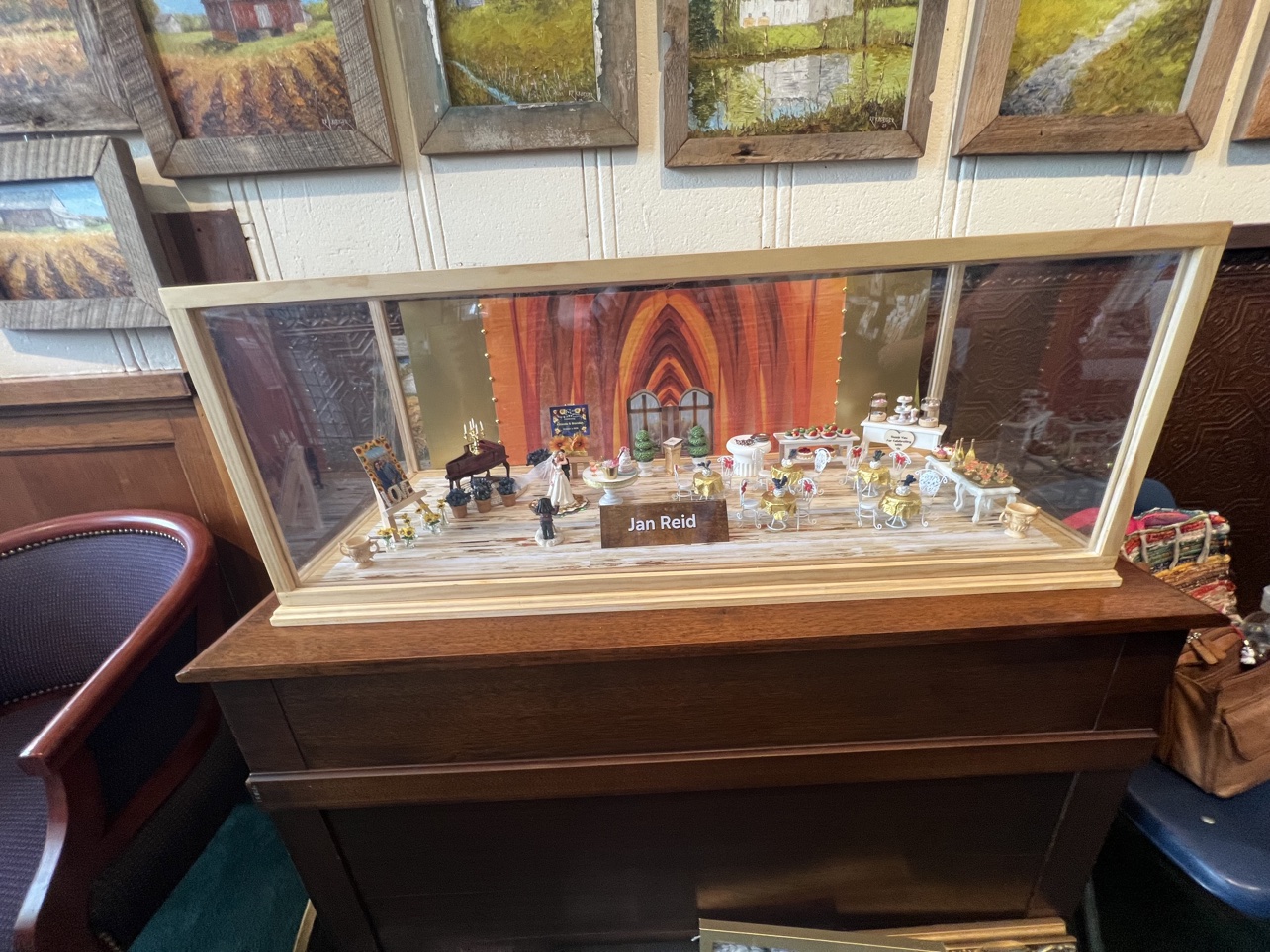 Jan Reid’s miniature wedding reception, built by hand inside a glass case.