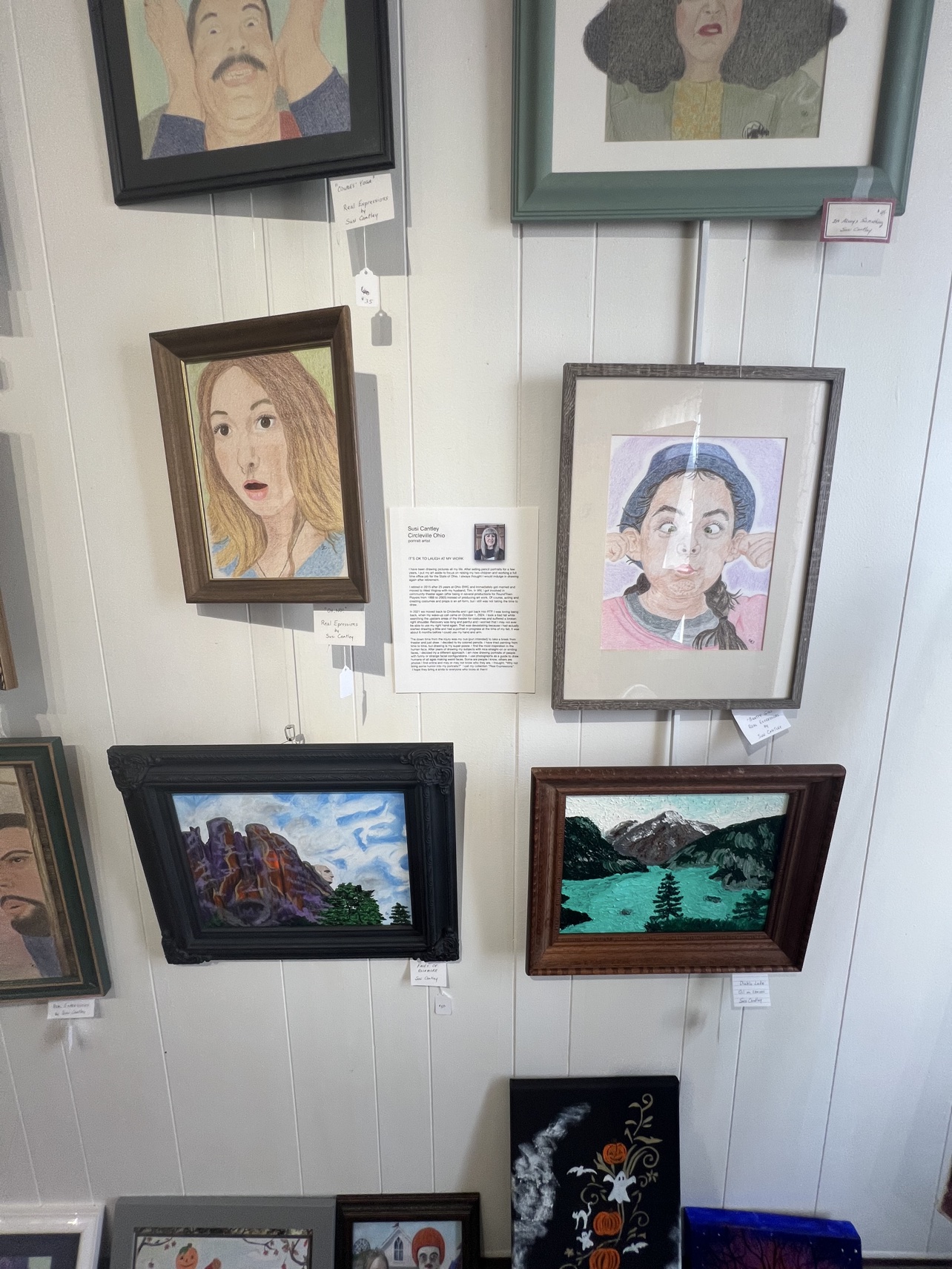 Portraits by Circleville artist Susi Cantley, whose Real Expressions series covers one section of wall.