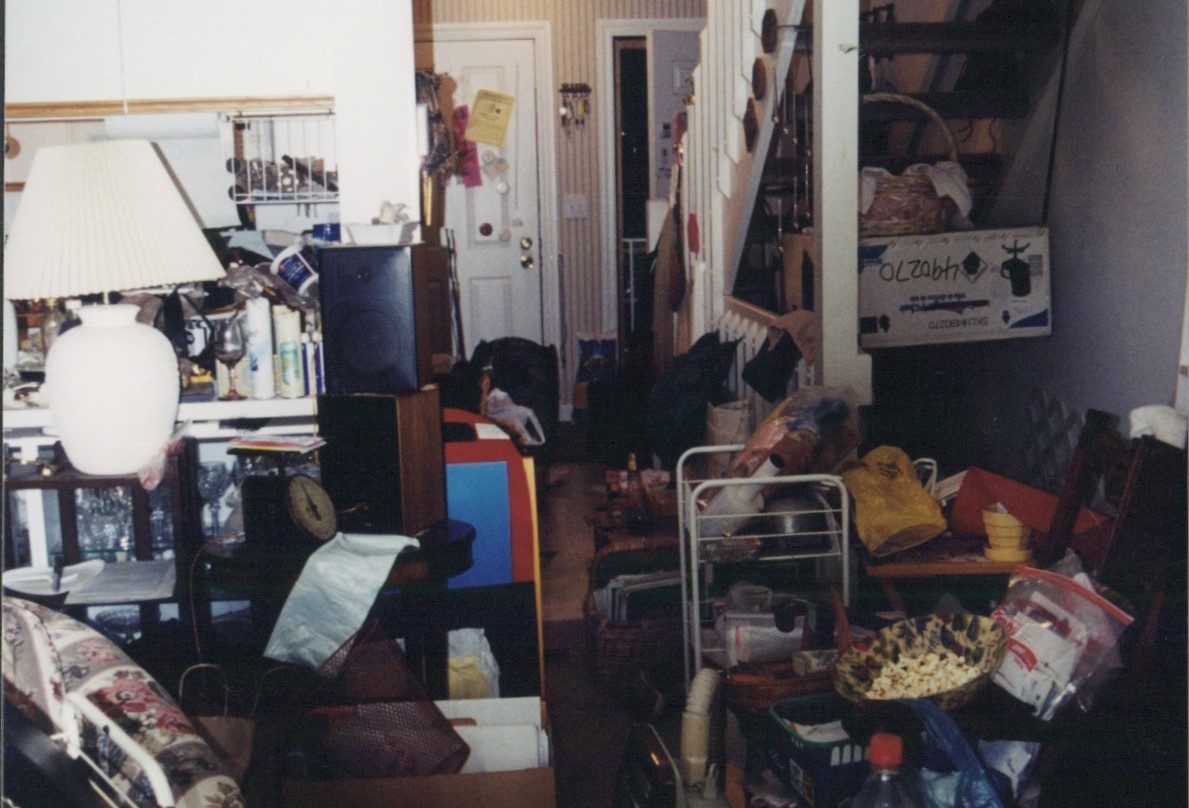 A cluttered hallway before organizing