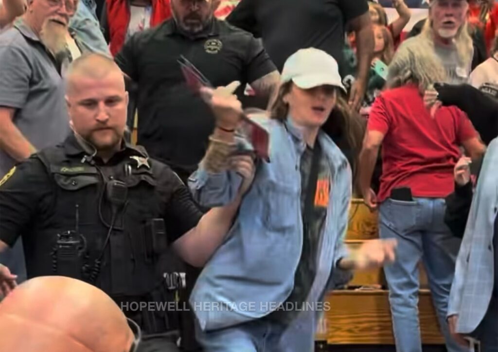 Deputy JoHansen removing a protester from the event