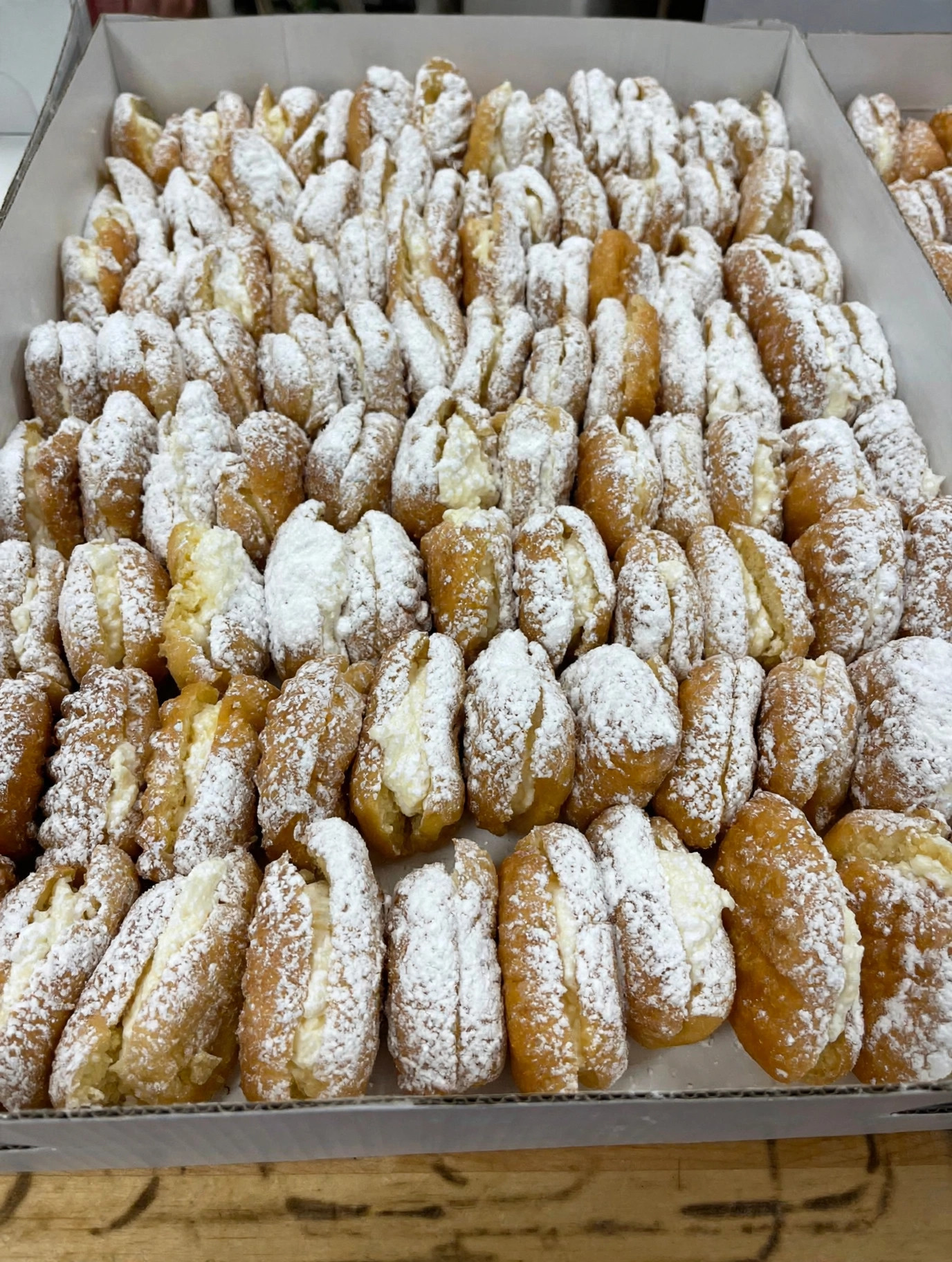 A box of freshly powdered bizmarks at New System Bakery in Chillicothe